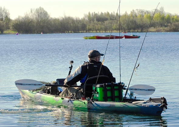 fisherman in his fishing kayak